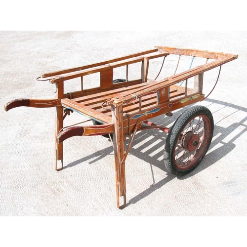 17 - A hand painted two-wheeled hand cart, 153cms (60ins) long.