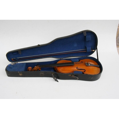 57 - A one-piece backed violin and bow, the back 35.5cms (14ins) long, in a pine carry case.