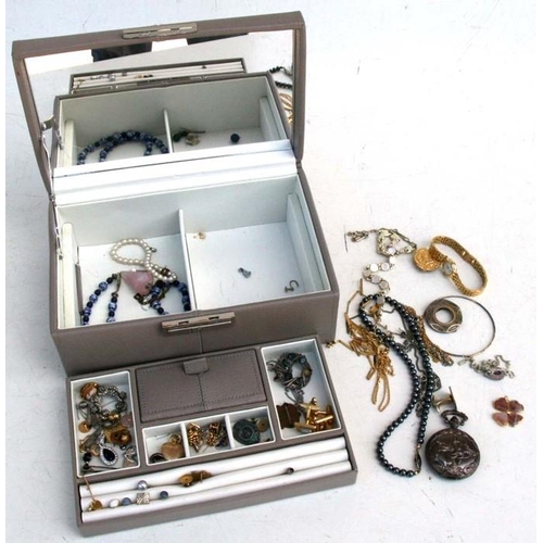 86 - A quantity of costume jewellery in a leather jewellery box