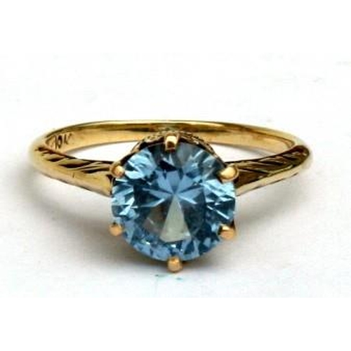 95 - A 10ct gold ring set with a single topaz. Approx UK size L