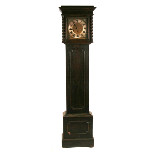 74 - An oak cased long case clock, the silvered dial with roman numerals.