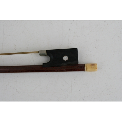 57 - A one-piece backed violin and bow, the back 35.5cms (14ins) long, in a pine carry case.