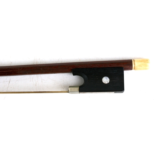 57 - A one-piece backed violin and bow, the back 35.5cms (14ins) long, in a pine carry case.