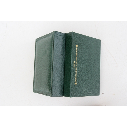 64 - A green leather watch box marked Rolex. 15cm (6 ins) wide