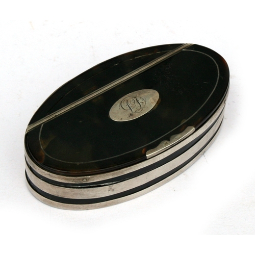 79 - A Georgian tortoiseshell and white metal banded oval snuff box. 10cm (4 ins) wide