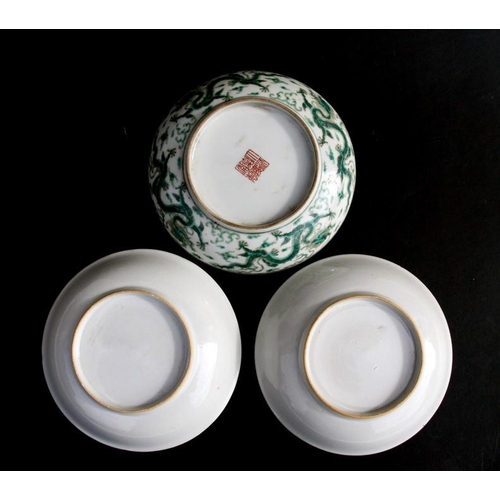 444 - A pair of Chinese famille rose saucer dishes decorated with flowers, 15cms (6ins) diameter; together... 