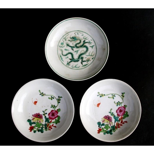 444 - A pair of Chinese famille rose saucer dishes decorated with flowers, 15cms (6ins) diameter; together... 