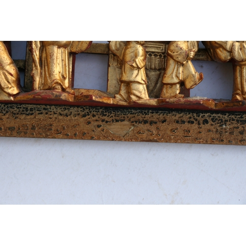 442 - A large Chinese pierced giltwood temple panel decorated with warriors in a landscape, 30 by 46cms (1... 