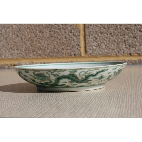 444 - A pair of Chinese famille rose saucer dishes decorated with flowers, 15cms (6ins) diameter; together... 