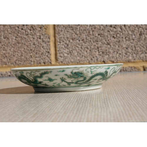 444 - A pair of Chinese famille rose saucer dishes decorated with flowers, 15cms (6ins) diameter; together... 