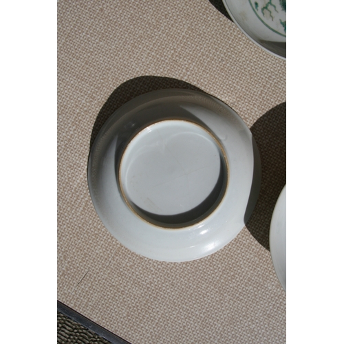 444 - A pair of Chinese famille rose saucer dishes decorated with flowers, 15cms (6ins) diameter; together... 