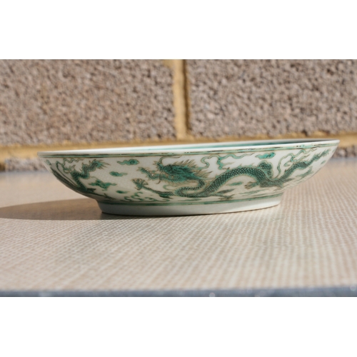 444 - A pair of Chinese famille rose saucer dishes decorated with flowers, 15cms (6ins) diameter; together... 