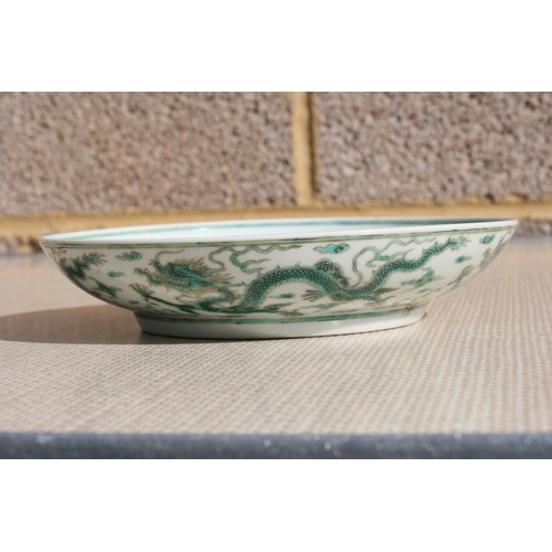 444 - A pair of Chinese famille rose saucer dishes decorated with flowers, 15cms (6ins) diameter; together... 