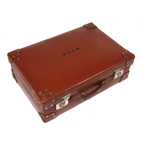 106 - A gentleman's fitted suitcase with silver topped bottles and ivory backed brushes.