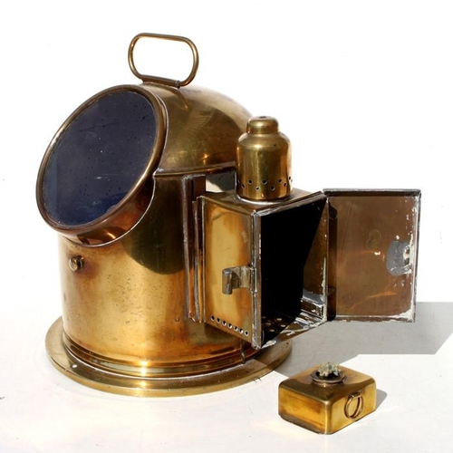 166 - A brass binnacle compass with side compartment oil lamp burner. Compass is marked A.T. Chamberlain &... 