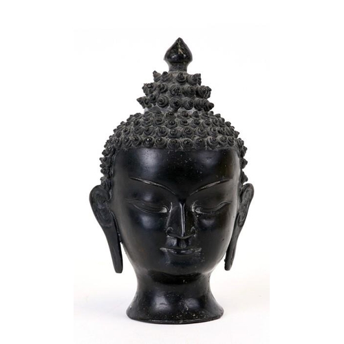 304 - An Asian cast bronze model of a Buddha's head, 17cms (6.75ins) high.