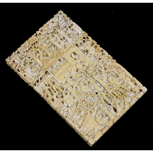 314 - A 19th century Chinese ivory visiting card case highly carved with figures in a landscape, 11.5cms (... 