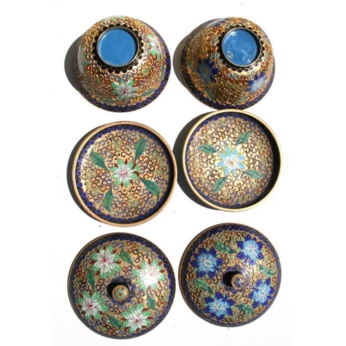 318 - A pair of Chinese gilt metal and enamel bowls, cover and stands, 13cm (5ins) diameter.