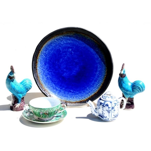 322 - A Japanese blue glaze plate, 28cm (11ins) diameter; together with a blue & white miniature tea p... 