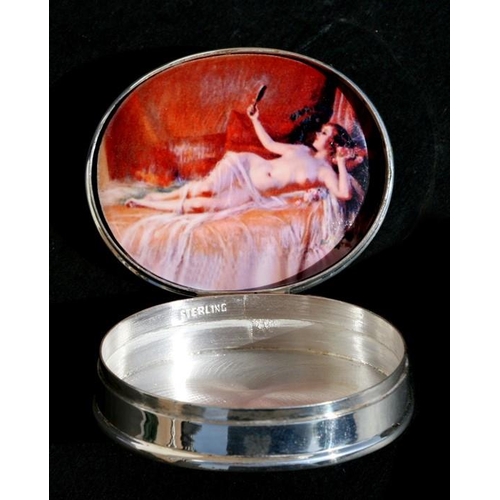 93 - A Sterling silver pill box with enamelled picture depicting a reclining nude to the interior, 5cm (2... 