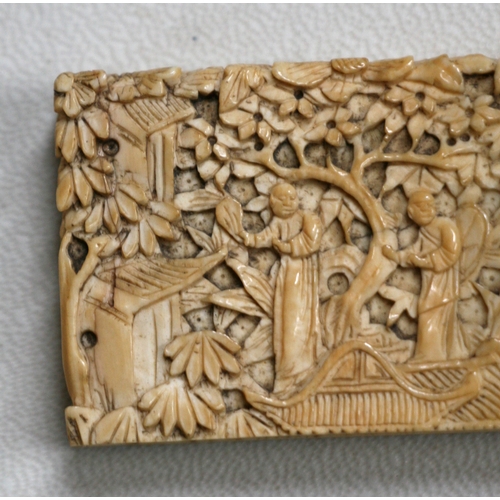 314 - A 19th century Chinese ivory visiting card case highly carved with figures in a landscape, 11.5cms (... 