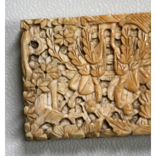 314 - A 19th century Chinese ivory visiting card case highly carved with figures in a landscape, 11.5cms (... 