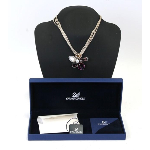 183 - A quantity of Swarovski jewellery to include pins, butterfly brooch and a boxed necklace.