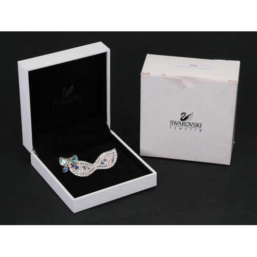 183 - A quantity of Swarovski jewellery to include pins, butterfly brooch and a boxed necklace.