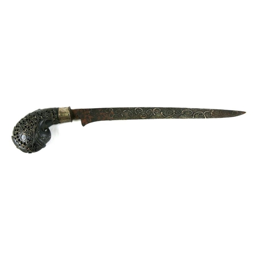 218 - An Asian or Middle Eastern dagger, the steel blade with silver inlay, the pierced stone handle in th... 