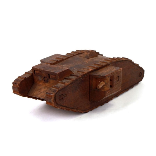 227 - A nicely carved hardwood WW1 trench art Tank. Overall length 22cms (8.75ins)