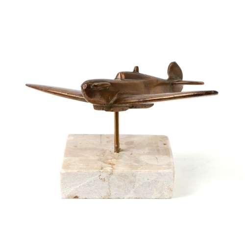 236 - A brass model of a WW2 Supermarine Spitfire mounted on a marble base. Wingspan 14.5cms (5.75ins)