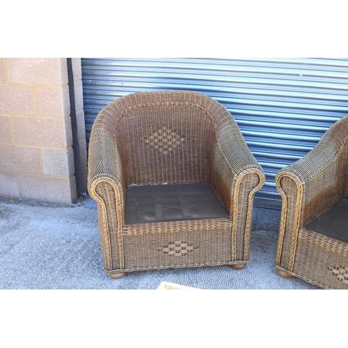 24 - A pair of conservatory chairs; together with a matching glass topped coffee table (3).Condition Repo... 