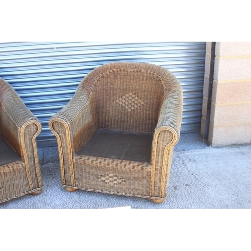 24 - A pair of conservatory chairs; together with a matching glass topped coffee table (3).Condition Repo... 