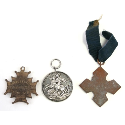 245 - Two late 19th century Army Temperance Association medals together with an early 20th century medal e... 