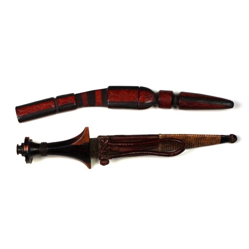 248 - Two African tribal daggers in leather sheaths. Blade lengths of 15cms (5.875ins) and 22cms (8.625ins... 