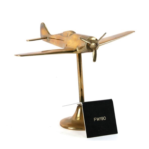 274 - A WW2 brass model of the German Focke-Wulf FW190 with spinning propeller standing on its brass base,... 