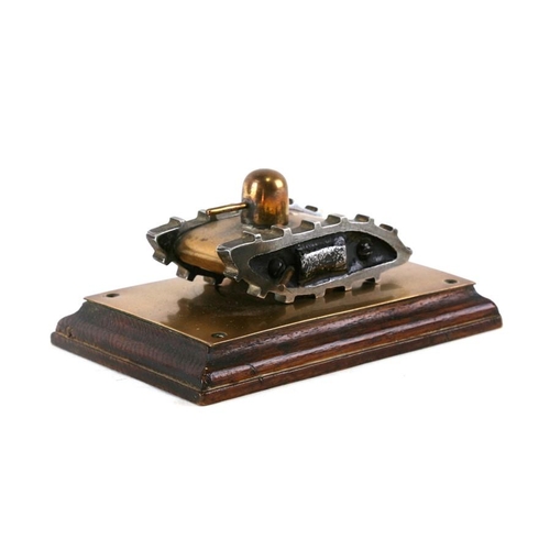 276 - A brass and aluminium trench art model of a WW1 Tank with turrett, mounted on a brass and wood base.... 