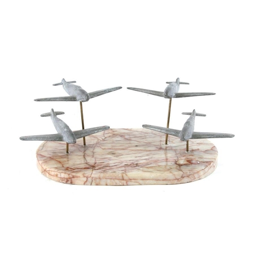 291 - An unusual flight of four cast aluminium WW2 British fighter aircraft mounted on a marble base. Wing... 