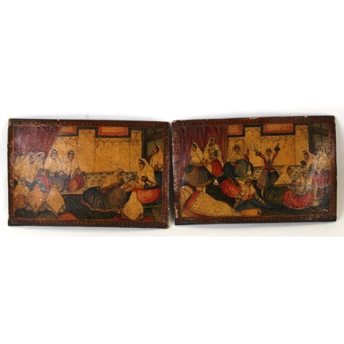 319 - A pair of Persian lacquer book covers decorated with interior scenes depicting ladies and children, ... 