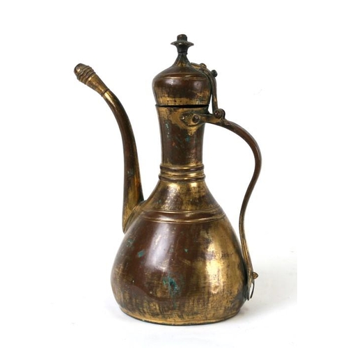 323 - A Turkish gilt copper coffee pot or ewer, 23cms (9ins) high.