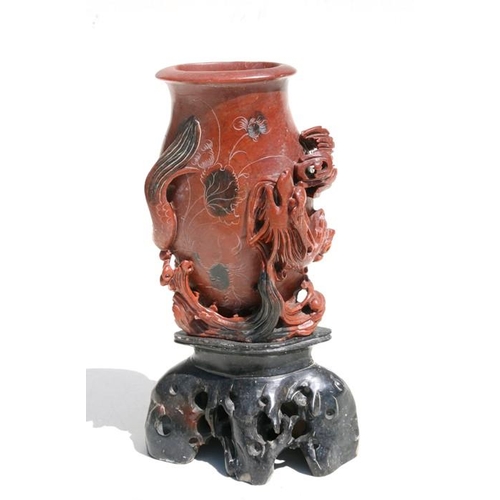 331 - A Chinese carved soapstone vase, decorated a dragon, 24cm (9.5ins) high