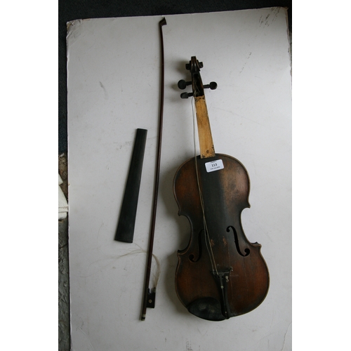 113 - A two-piece backed violin and bow, 60cm (23.5ins) long.