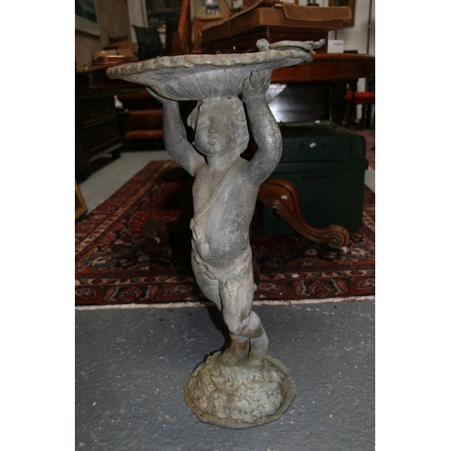 23 - A lead birdbath in the form of a cherub, 70cms (27.5ins) high.