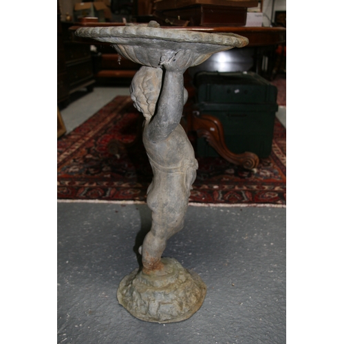 23 - A lead birdbath in the form of a cherub, 70cms (27.5ins) high.