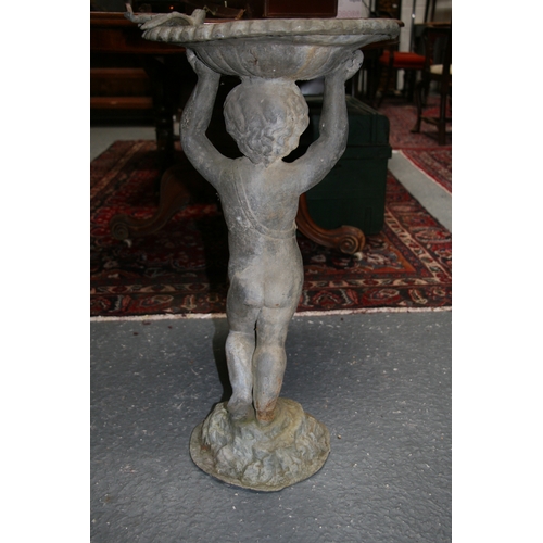 23 - A lead birdbath in the form of a cherub, 70cms (27.5ins) high.