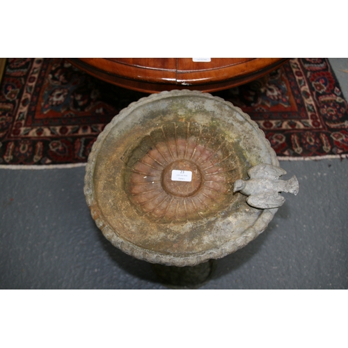 23 - A lead birdbath in the form of a cherub, 70cms (27.5ins) high.