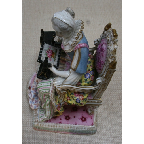 69 - A Meissen figure depicting a seated lady with her needlework, 24cm (9.5ins) high