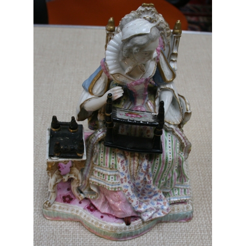 69 - A Meissen figure depicting a seated lady with her needlework, 24cm (9.5ins) high