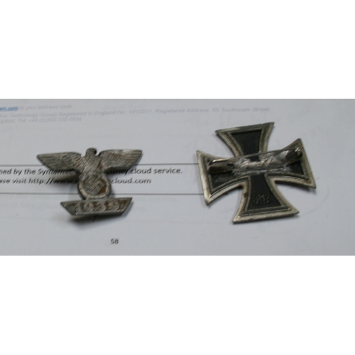 221 - A quantity of WWII badges to include the Iron Cross.