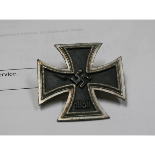 221 - A quantity of WWII badges to include the Iron Cross.